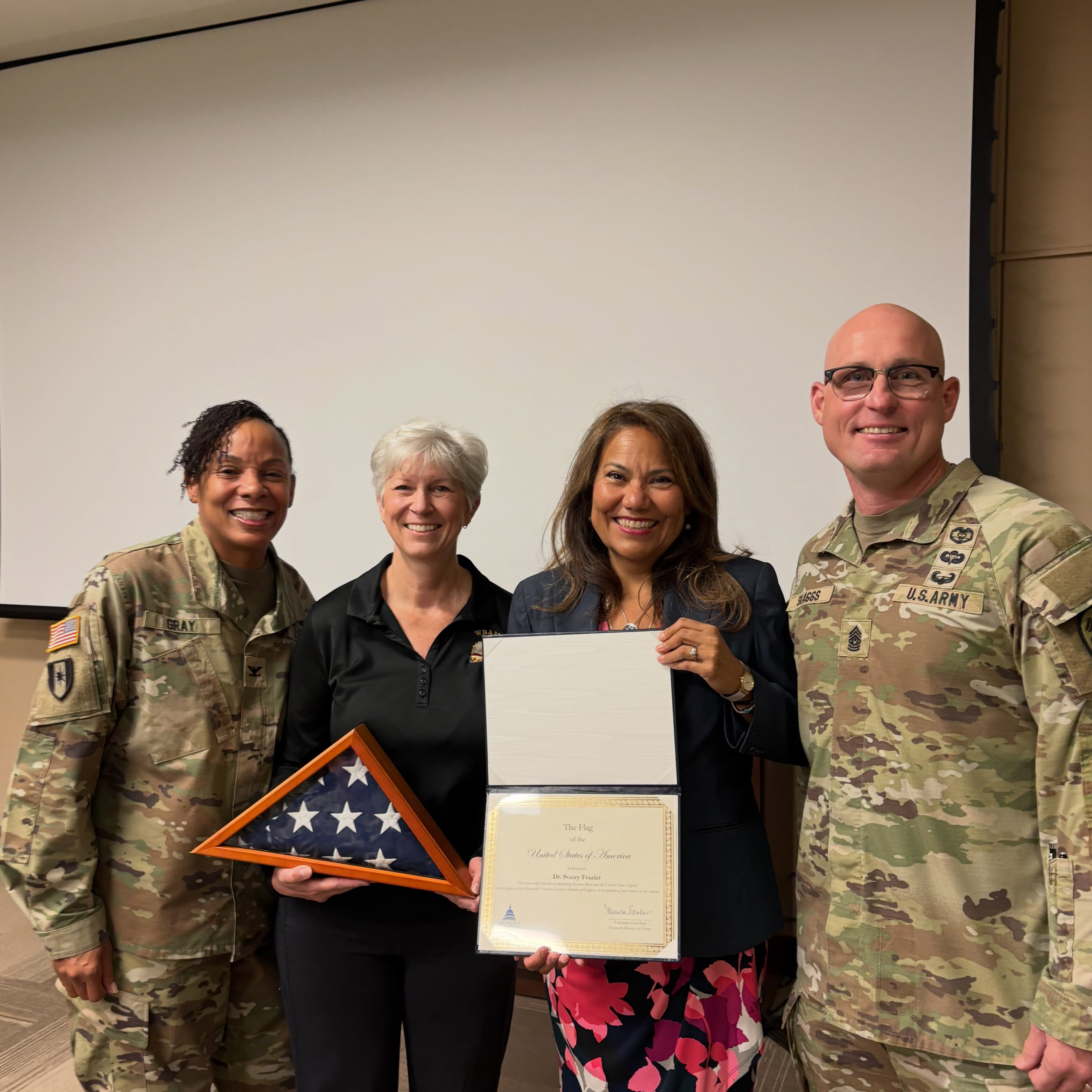 Presenting flags to 3 staff retiring from WBAMC